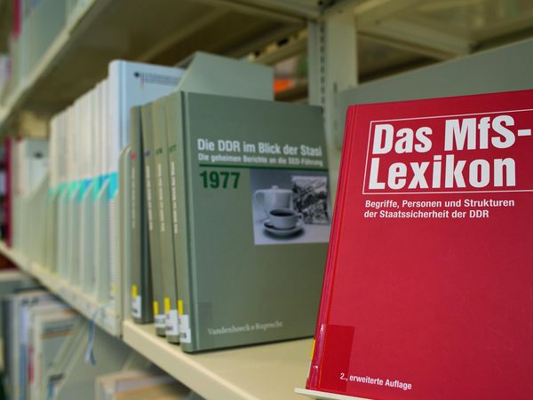 The Stasi Records Agency publishes several publications a year. A shelve in a library with several books.