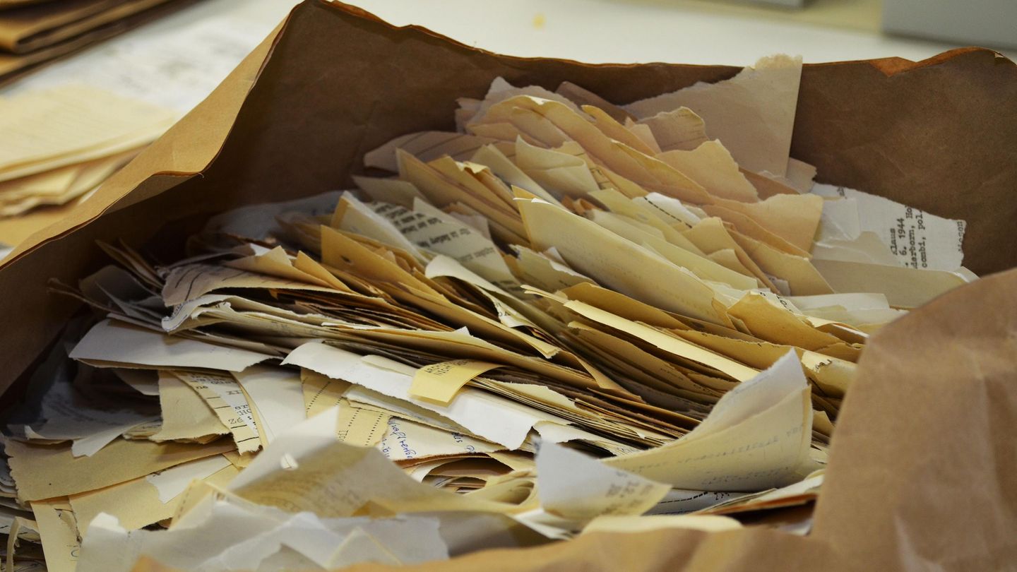 Hand-torn documents in the Stasi Records Archive., Source:
                BStU